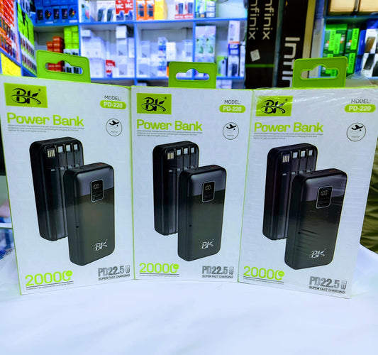 Three packages of BK power banks on a shelf with a store background.