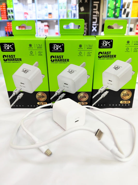 White fast charger with USB-C cable in front of green and black branded boxes.